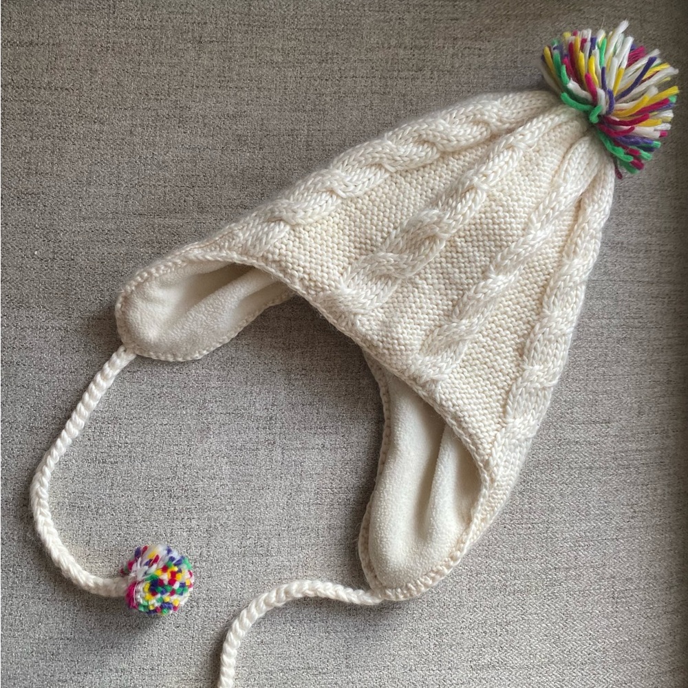 Women’s Knit hat with vintage style pom poms and ear flaps